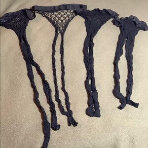 4 black fishnet stockings with different size weave.  See pictures for size.